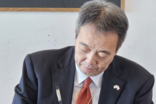 JAPANESE AMBASSADOR Koichi Mizushima writes at the ‘Kakizome’ ceremony.  (credit: EYAL HIRSCH)