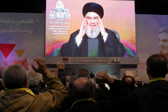   Lebanon's Hezbollah leader Sayyed Hassan Nasrallah addresses his supporters through a screen during a ceremony to mark the fourth anniversary of the killing of senior Iranian military commander General Qassem Soleimani in a U.S. attack, in Beirut's southern suburbs, Lebanon January 3, 2024.  (credit:  REUTERS/Mohamed Azakir/File Photo)