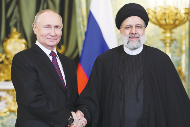 The Russian and Iranian Presidents meet in Moscow last month. Increasingly, Tehran is acting not just as an ally but as a proxy for Russia in the Middle East, much as it has its own regional proxies, the writers maintain. (credit: SPUTNIK/REUTERS)