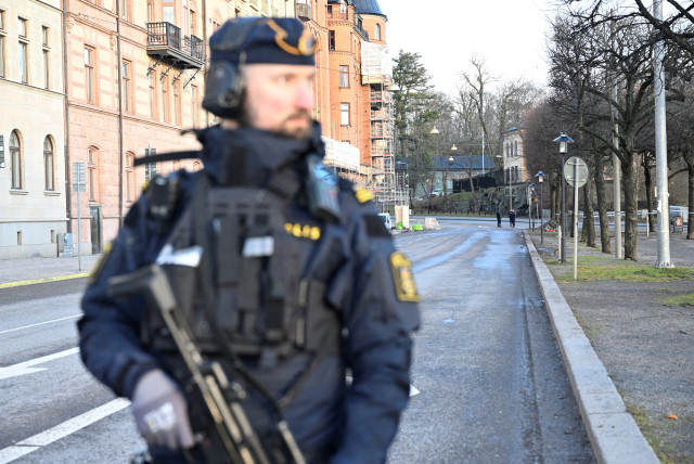 Emergency workers stand near the Israeli embassy in Stockholm, January 31, 2024 (credit:  HENRIK MONTGOMERY/TT NEWS AGENCY/VIA REUTERS)