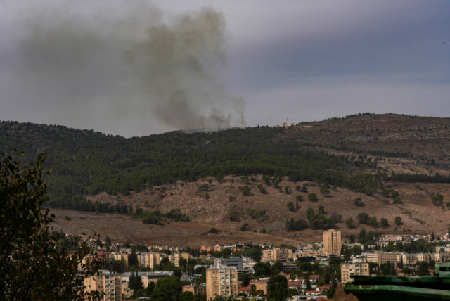  Smoke rises during an exchange of fire between the IDF and terrorists from the Hezbollah organization on the border between Israel and Lebanon, November 11, 2023 (credit:  Ayal Margolin/Flash90)