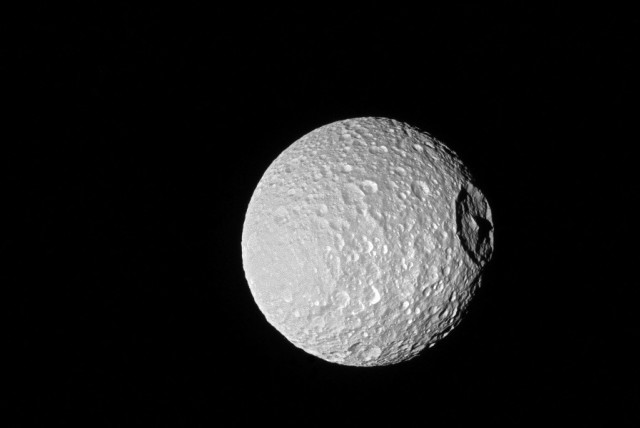  Saturn's moon Mimas is seen in this image from NASA's Cassini spacecraft (credit: REUTERS)