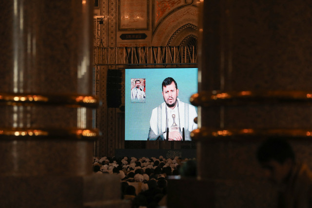  Houthi leader Abdul-Malik al-Houthi addresses followers via a video link at the al-Shaab Mosque, formerly al-Saleh Mosque, in Sanaa, Yemen February 6, 2024. (credit: REUTERS/KHALED ABDULLAH)