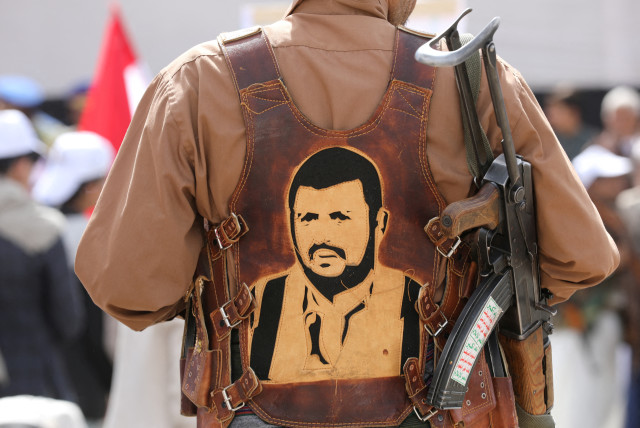  A Houthi follower wears a vest portraying the Houthi leader Abdul-Malik al-Houthi during a parade held as part of a 'popular army' mobilization campaign by the movement, in Sanaa, Yemen February 7, 2024. (credit: REUTERS/KHALED ABDULLAH)