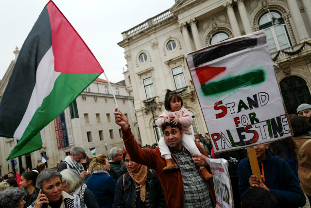  People take part in a demonstration in solidarity with Palestinians in Gaza, amid the ongoing conflict between Israel and the Palestinian group Hamas, in Lisbon, Portugal, November 16, 2023 (credit: PEDRO NUNES/REUTERS)