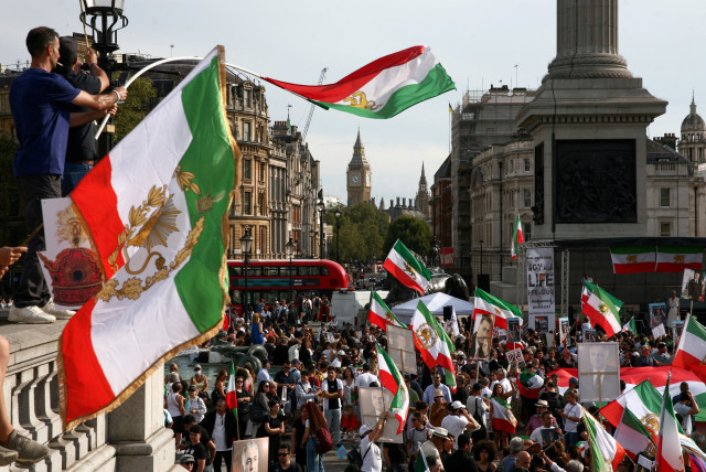 People protest in Trafalgar Square on the first anniversary of the death in custody of Mahsa Amini, a 22-year-old Kurdish woman arrested by the morality police in 2022 for allegedly flouting mandatory dress codes, in London, Britain, September 16, 2023. (credit: REUTERS/KEVIN COOMBS)