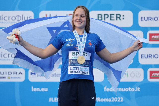  Israel's Anastasia Gorbenko celebrates on the podium after winning gold at the European Aquatics Championships (credit: REUTERS/ANTONIO BRONIC)