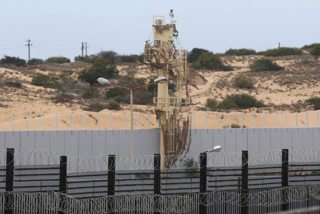  A border wall stands between Rafah and Egypt, amid fears of an exodus of Palestinians into Egypt, as the conflict between Israel and Hamas continues, in Rafah southern Gaza Strip February 16, 2024 (credit: IBRAHEEM ABU MUSTAFA/REUTERS)
