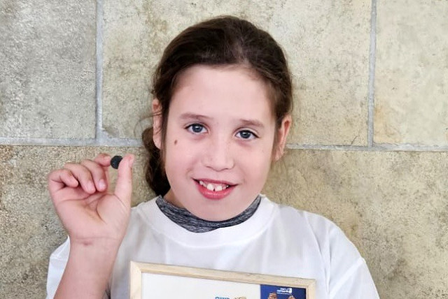  Nati Toyikar, 11, who found the 2,000 year old coin. (credit: Israel Antiquities Authority)