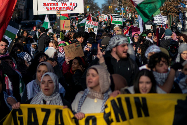  Pro-Palestinian demonstrators march after taking part in a rally demanding a ceasefire and the end of Israel attacks on Gaza at the borough of Queens in New York, U.S., February 19, 2024. (credit: REUTERS/EDUARDO MUNOZ)