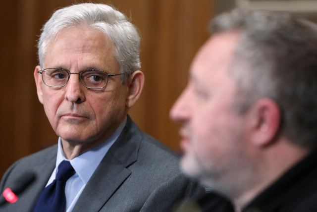  Attorney General Merrick B. Garland looks over at Ukrainian Prosecutor General Andriy Kostin as he speaks about the prosecution of war crimes in Ukraine committed by Russian forces during a press conference at the Department of Justice in Washington, D.C. on April 17, 2023. (credit: REUTERS/AMANDA ANDRADE-RHOADES)