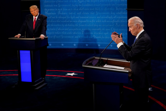  Democratic presidential candidate former Vice President Joe Biden answers a question as President Donald Trump listens during the second and final presidential debate at the Curb Event Center at Belmont University in Nashville, Tennessee, U.S., October 22, 2020. (credit: Morry Gash/Reuters)
