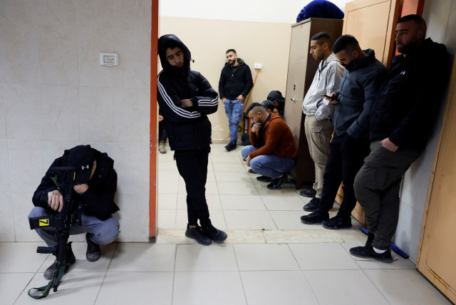  People react as they mourn the Palestinian terrorists killed in clashes Israeli forces during a raid, at a hospital in Tubas, in the West Bank, February 27, 2024. (credit: RANEEN SAWAFTA/REUTERS)