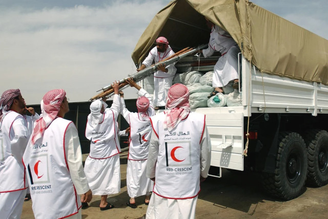  Members of the United Arab Emirates (UAE) Red Crescent Society load humanitarian aid and relief supplies onto a cargo truck, after the vehicle was checked for explosives, at the port of Umm Qasr Iraq, during Operation IRAQI FREEDOM (credit:  NARA & DVIDS Public Domain Archive)