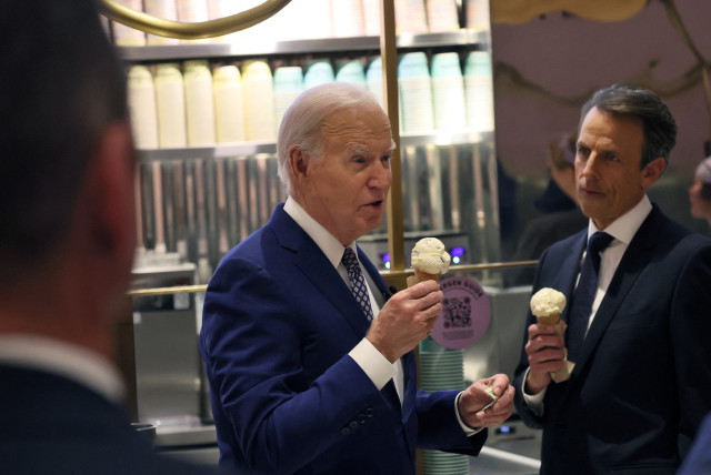  US President Joe Biden answers a question from a member of the news media as he and Seth Meyers visit Van Leeuwen Ice Cream in downtown New York, US February 26, 2024. (credit: REUTERS)