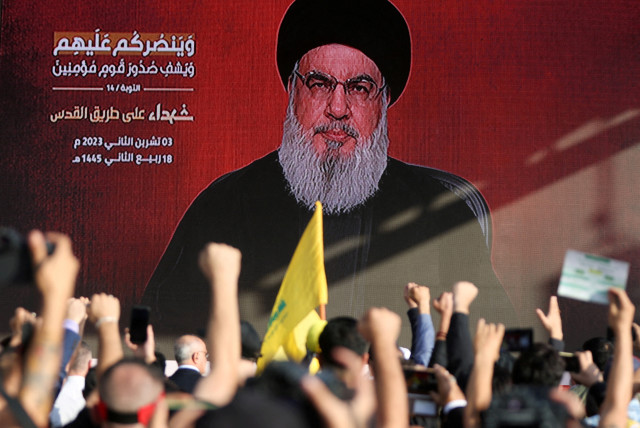  Lebanon's Hezbollah leader Sayyed Hassan Nasrallah appears on a screen as he addresses his supporters during a ceremony to honour fighters killed in the recent escalation with Israel, in Beirut's southern suburbs, Lebanon November 3, 2023. (credit: REUTERS/MOHAMED AZAKIR)