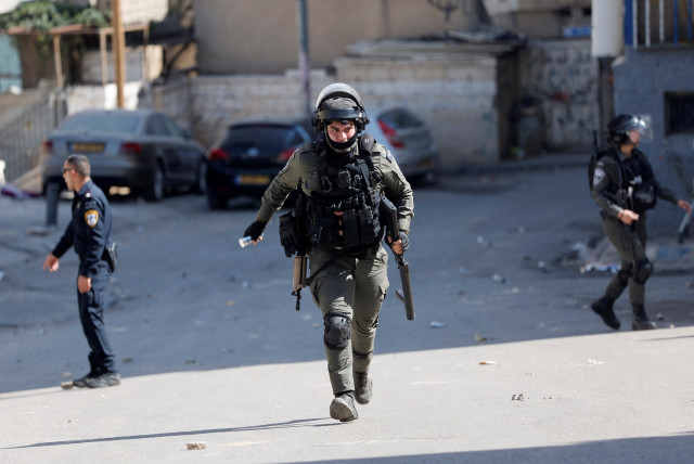  Israeli border police officer walks during clashes with Palestinians in Silwan neighbourhood in East Jerusalem, March 3, 2023. (credit: AMMAR AWAD/REUTERS)