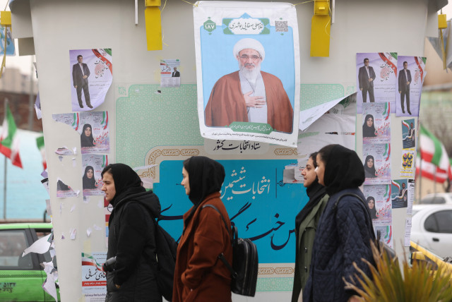  People walk past campaign posters for the parliamentary election in Tehran, Iran, February 26, 2024. (credit:  MAJID ASGARIPOUR/WANA (WEST ASIA NEWS AGENCY) VIA REUTERS)