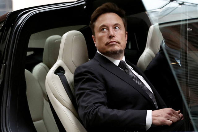  Tesla Chief Executive Officer Elon Musk gets in a Tesla car as he leaves a hotel in Beijing, China May 31, 2023. (credit: TINGSHU WANG/REUTERS)