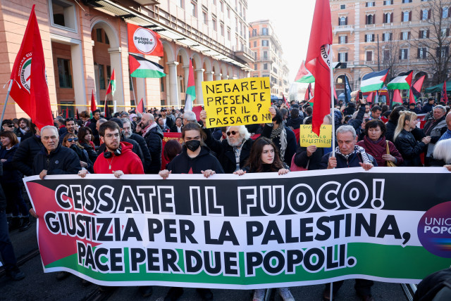 Pro-Palestinian protestors hold a banner during a demonstration demanding an immediate ceasefire in Gaza, as the conflict between Israel and the Palestinian Islamist group Hamas continues, in Rome, Italy, January 27, 2024. The banner reads: ''Cease fire! Justice for Palestine, peace for two peoples (credit: REUTERS/CLAUDIA GRECO)