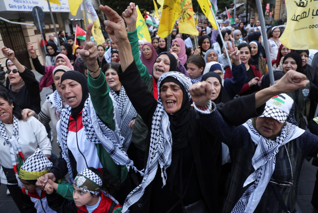  Palestinian women carry flags and gesture during a demonstration in support of Palestinians in Gaza, amid the ongoing conflict between Israel and the Palestinian Islamist group Hamas, in Beirut, Lebanon March 2, 2024. (credit: MOHAMED AZAKIR/REUTERS)