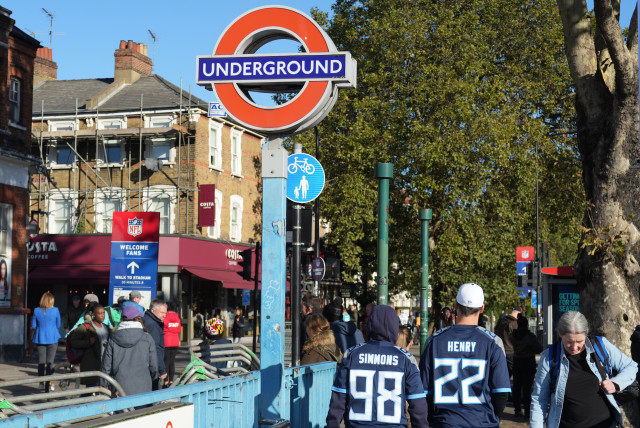 Oct 15, 2023; London, United Kingdom; A fan wearing a NFL jersey departs the Seven Sisters underground station before an NFL International Series game at Tottenham Hotspur Stadium. (credit: KIRBY LEE/USA TODAY/VIA REUTERS)