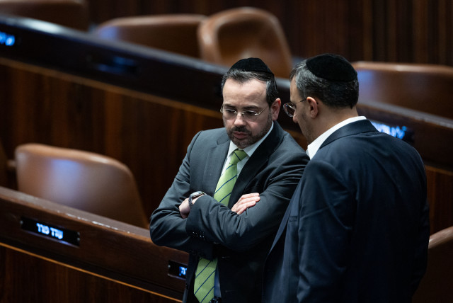 Minister of Health Uriel Buso speaks with MK Yoni Mashriki discussion and a vote on the state budget at the assembly hall of the Israeli parliament in Jerusalem, February 7, 2024. (credit: YONATAN SINDEL/FLASH90)