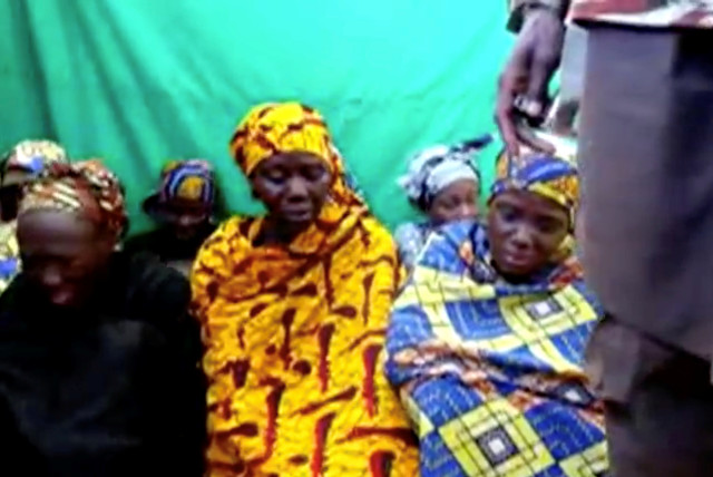  Remaining girls who were kidnapped from the northeast Nigerian town of Chibok are seen in an unknown location in Nigeria in this still image taken from an undated video obtained on January 15, 2018.  (credit: BOKO HARAM HANDOUT/SAHARA REPORTERS VIA REUTERS)