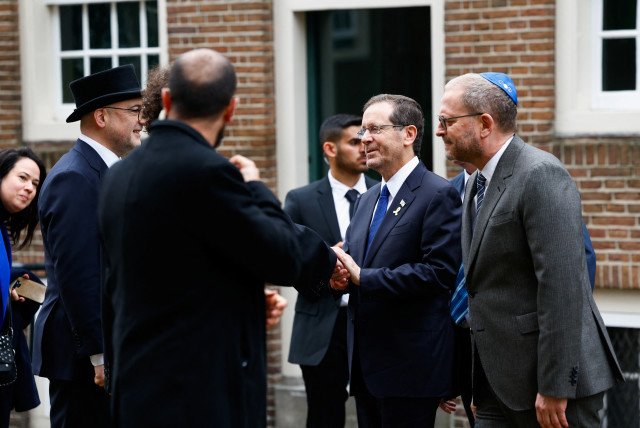  Israeli President Isaac Herzog arrives at the Portuguese Synagogue on the day of the opening of the National Holocaust Museum, in Amsterdam, Netherlands, March 10, 2024. (credit: REUTERS/PIROSCHKA VAN DE WOUW)