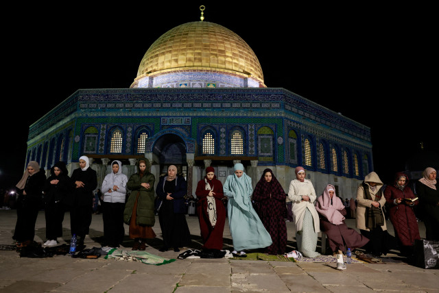 Muslim worshippers take part in the evening 'Tarawih' prayers during of the Muslim holy month of Ramadan, in front of the Dome of the Rock on the Temple Mount in Jerusalem’s Old City March 10, 2024. (credit: AMMAR AWAD/REUTERS)
