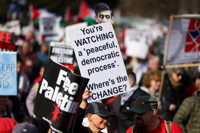  A demonstrator holds a placard with a cut-out depicting British Prime Minister Rishi Sunak during a pro-Palestinian protest, amid the ongoing conflict between Israel and the Palestinian Islamist group Hamas, in London, Britain March 9, 2024. (credit: HOLLIE ADAMS/REUTERS)