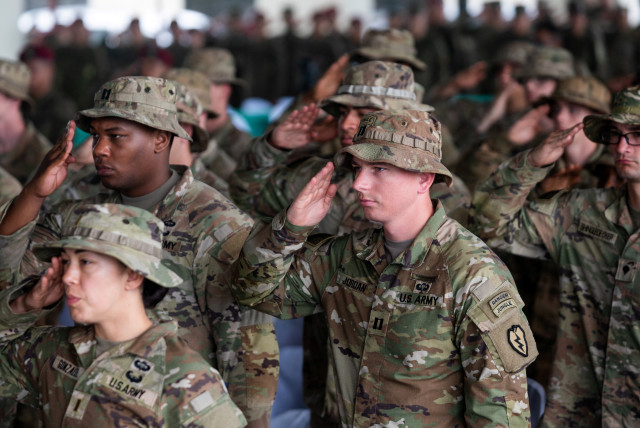  American soldiers salute as the national anthem plays during the opening ceremonies of Salaknib, the annual bilateral exercise between Philippine and U.S. Army, at Fort Magsaysay, Nueva Ecija province, Philippines, March 13, 2023. (credit: REUTERS/LISA MARIE DAVID)