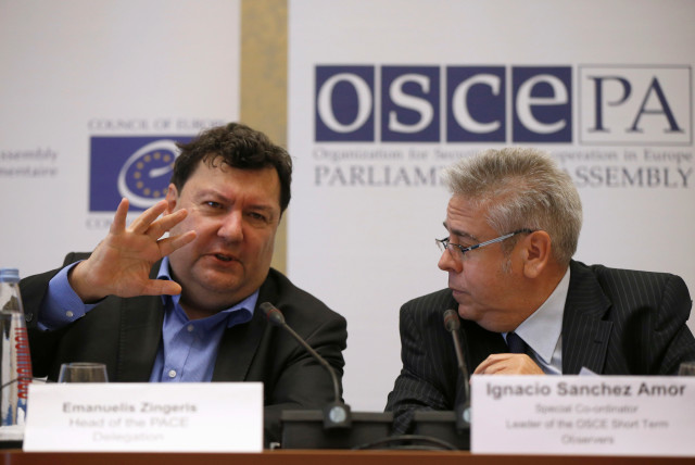  Ignacio Sanchez Amor (R), a leader of the OSCE Short Term Observers, listens to Emanuelis Zingeris, a head of PACE Delegation during a news conference after the parliamentary election in Tbilisi, Georgia, October 9, 2016.  (credit: DAVID MDZINARISHVILI/REUTERS)