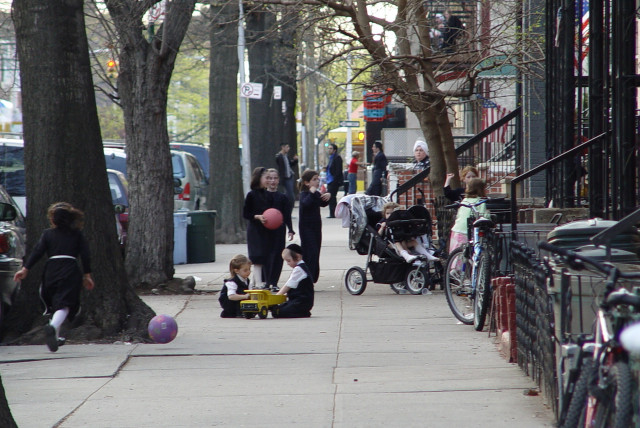  Hasidic children play on the street in Borough Park, Brooklyn. (credit: Lord Ice / CC 3.0 / https://creativecommons.org/licenses/by-sa/3.0/deed.en)