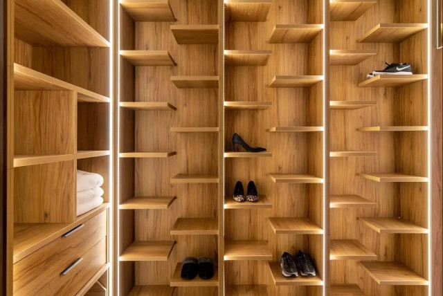   Wall for shoes in the closet  (credit: Yoav Peled, Studio Peled)