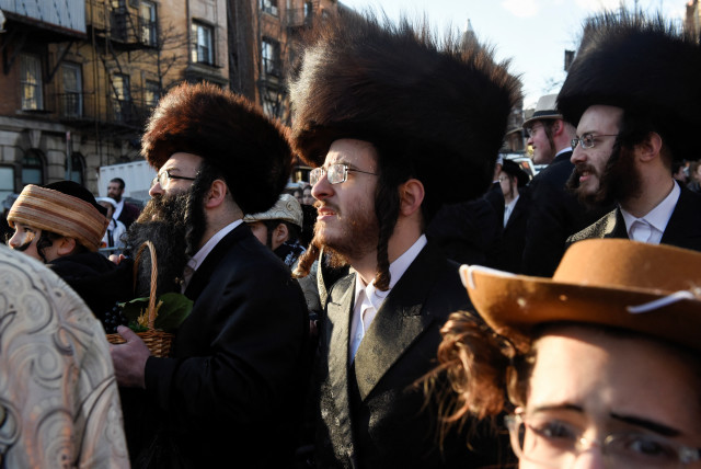  People gather for celebrations to mark the Jewish holiday of Purim, in the Brooklyn borough of New York City, U.S., March 7, 2023.  (credit: STEPHANIE KEITH/REUTERS)
