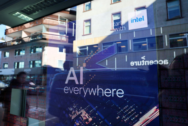  A slogan related to Artificial Intelligence (AI) is displayed on a screen in Intel pavilion, during the 54th annual meeting of the World Economic Forum in Davos, Switzerland, January 16, 2024. (credit: DENIS BALIBOUSE/REUTERS)