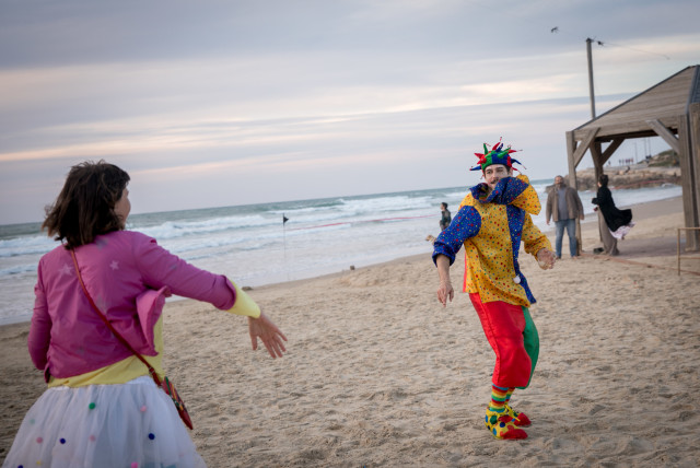  People dressed up in costumes attend a dance party by the beach in Tel Aviv, during the Jewish holiday of Purim. March 23, 2024. (credit: MIRIAM ALSTER/FLASH90)