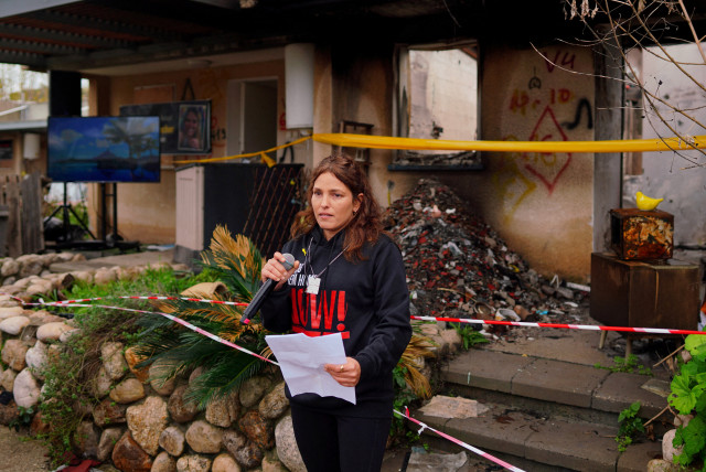  Released hostage Amit Soussana, kidnapped on the deadly October 7 attack by Palestinian Islamist group Hamas, talks to the press in front of her destroyed home at the Kibbutz Kfar Aza, Israel, January 29, 2024 (credit: REUTERS/ALEXANDRE MENEGHINI)