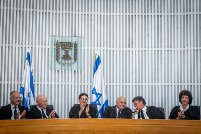  Former Supreme Court chief justice Esther Hayut (C) with former Supreme Court judge George Karra (to her L) and Supreme Court justices at an outgoing ceremony held for Karra, 2022 (credit: YONATAN SINDEL/FLASH90)