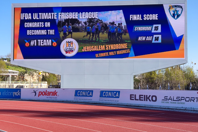  The HU Givat Ram Stadium management projected this graphic on the large scoreboard overlooking Jerusalem Syndrome’s home field to celebrate with the team on its win over New Age. ‘Some of us didn’t believe it and thought it was photoshopped,’ the writer says.  (credit: Ehud Dahan & Jonathan Jung)