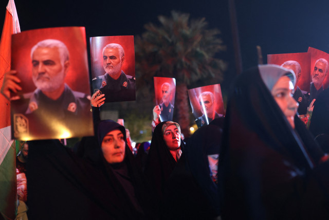  Iranian hold pictures of the late Iranian Major-General Qassem Soleimani, during a gathering in support of Palestinians, in Tehran, Iran, October 7, 2023. (credit: Majid Asgaripour/WANA/via Reuters)