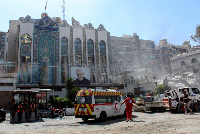  An ambulance is parked outside the Iranian embassy after a suspected Israeli strike on Monday on Iran's consulate, which Iran said had killed seven military personnel Damascus, Syria April 2, 2024.  (credit: FIRAS MAKDESI/REUTERS)