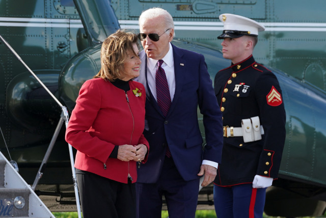  US President Joe Biden speaks to US Representative Nancy Pelosi (D-CA) as he arrives in San Francisco, California, US February 21, 2024. (credit: REUTERS/KEVIN LAMARQUE)