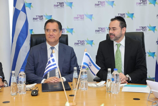  Greek Health Minister Adonis Georgiadis and his Israeli counterpart MK Uriel Busso sign an agreement. April 8, 2024. (credit: MIRI SHIMONOVICH/GPO)