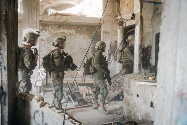 IDF soldiers from the Nahal Brigade operate in the central Gaza Strip, April 10, 2024 (credit: IDF SPOKESPERSON'S UNIT)