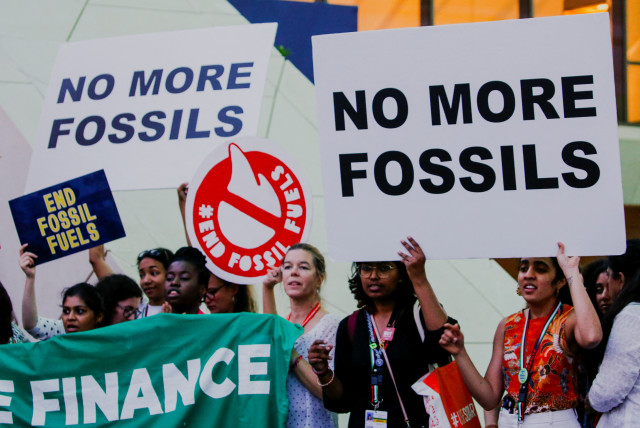  Climate activists protest against fossil fuels at Dubai's Expo City during the United Nations Climate Change Conference COP28 in Dubai, United Arab Emirates, December 12, 2023. (credit: Thomas Mukoya/Reuters)