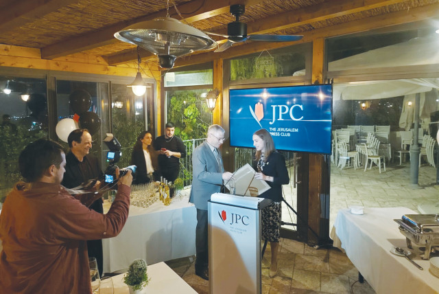  URI DROMI receives a memento of his years at the helm of JPC from his successor, Talia Dekel-Fleissig.  (credit: STEVE LINDE)