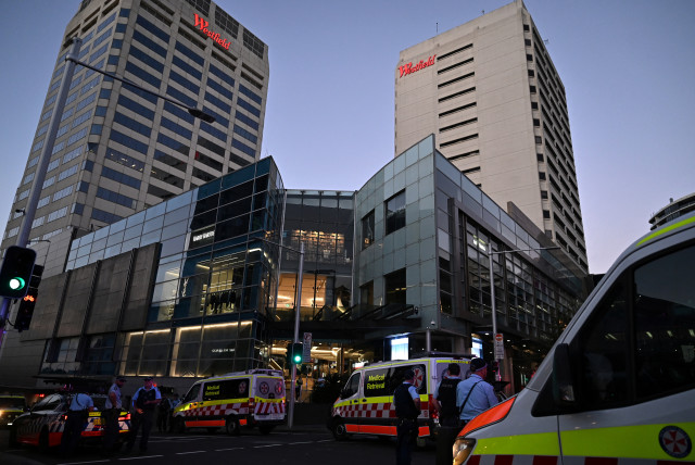  Emergency service workers stand near Bondi Junction after multiple people were stabbed inside the Westfield Bondi Junction shopping centre in Sydney, April 13, 2024. (credit: AAP Image/Steven Saphore via REUTERS)