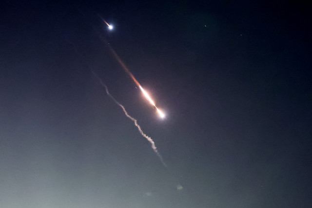  Objects are seen in the sky above Jerusalem after Iran launched drones and missiles towards Israel, in Jerusalem April 14, 2024. (credit: RONEN ZVULUN/REUTERS)
